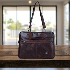 A dark brown, leather-like messenger bag