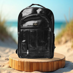 A black backpack is centered on a white background.