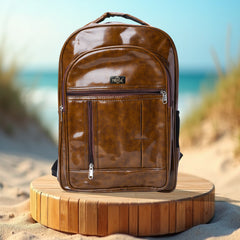 A full shot of a brown leather-like backpack.