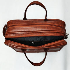 A full shot of a brown leather-like laptop bag or briefcase.