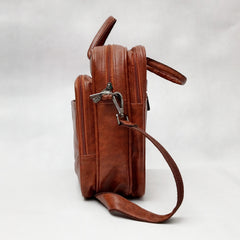 A full shot of a brown leather-like laptop bag or briefcase.