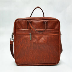 A full shot of a brown leather-like laptop bag or briefcase.