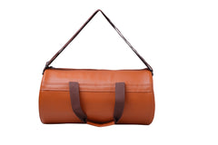 A light orange-brown, cylindrical duffel bag is centered against a plain white background