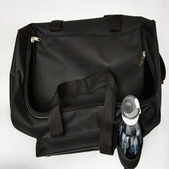 A black duffel bag is presented, featuring a simple design