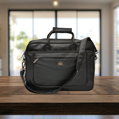 A black leather-like briefcase or laptop bag sits