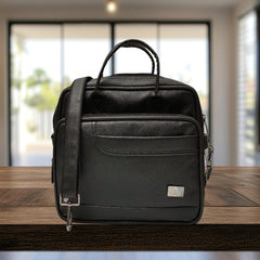 A black leather messenger bag sits