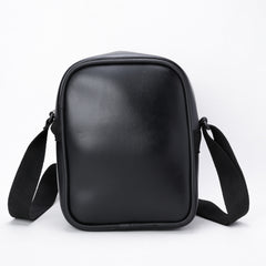 A black, faux-leather crossbody bag.