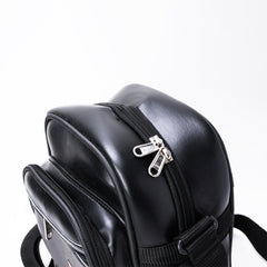A black, faux-leather crossbody bag.