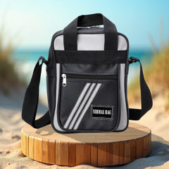 A black and gray crossbody bag.