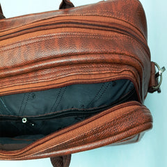 A brown leather-like laptop bag or briefcase