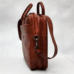 A brown leather-like laptop bag or briefcase