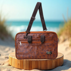 A medium-sized, light brown, leather-like laptop bag.