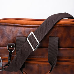 A medium-sized, light brown, leather-like laptop bag.