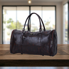 A dark brown, leather-like duffel bag sits on a light brown wooden surface
