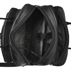 A black leather messenger bag sits